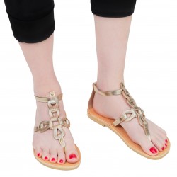 Sandalias de mujer hechas a mano con cordones cruzados en piel de becerro laminada dorada